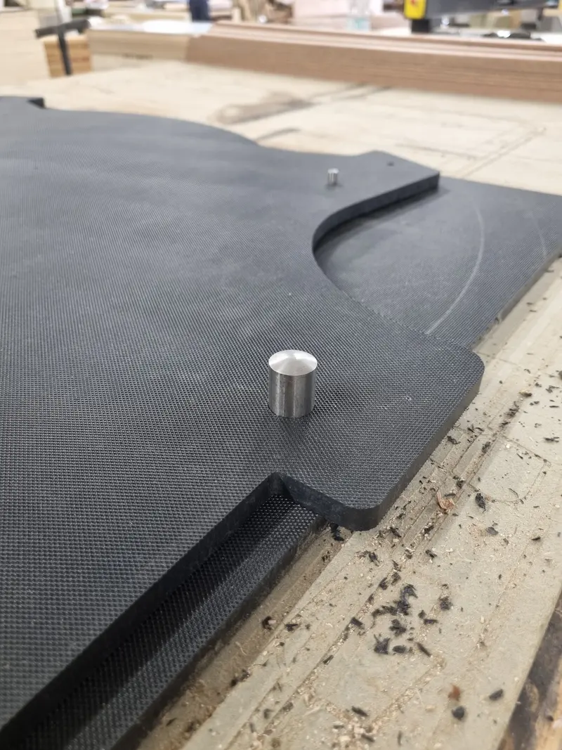 CNC-cut carbon fibre plate with a machined metal pin