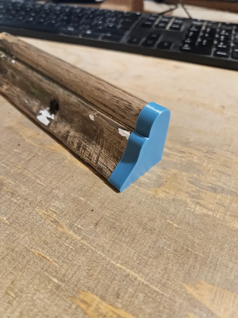 3D printed test piece matching the profile of a historic timber moulding, fitted to the original